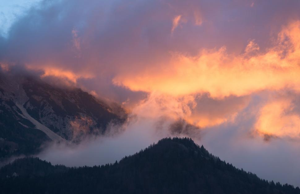 Free Image of Clouds over a mountain 
