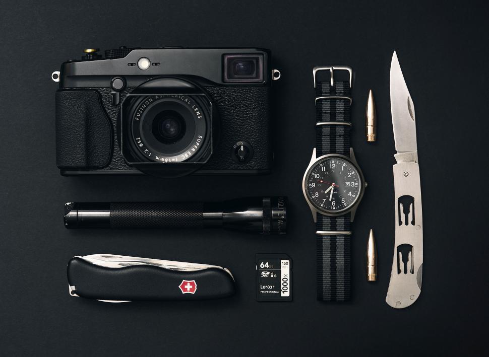 Free Image of A camera and pocket knife and a watch 