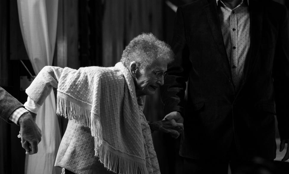 Free Image of An elderly woman holding hands 