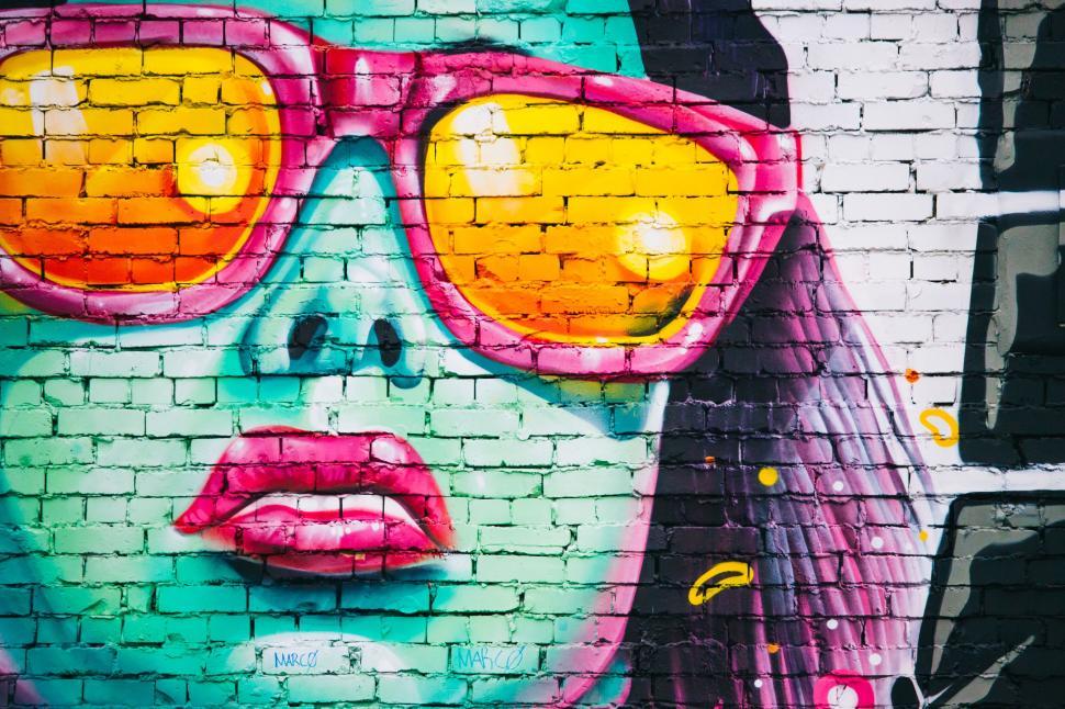 Free Image of A mural of a woman wearing sunglasses 