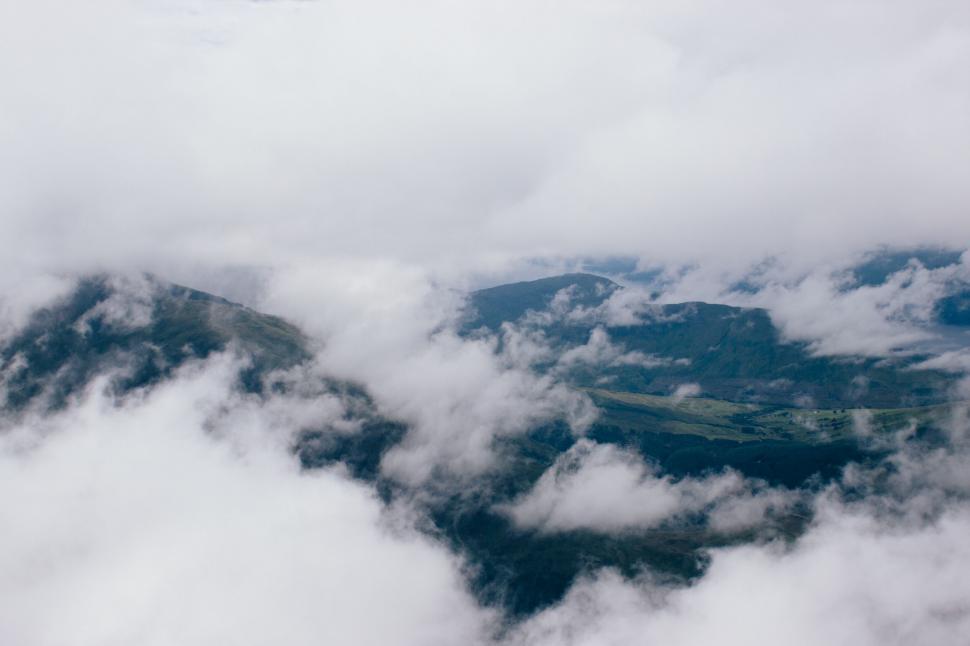 Free Image of Clouds above a valley 