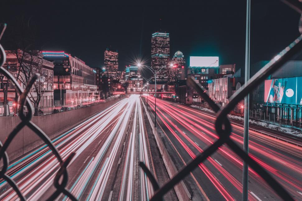 Free Image of A city skyline with lights on the road 