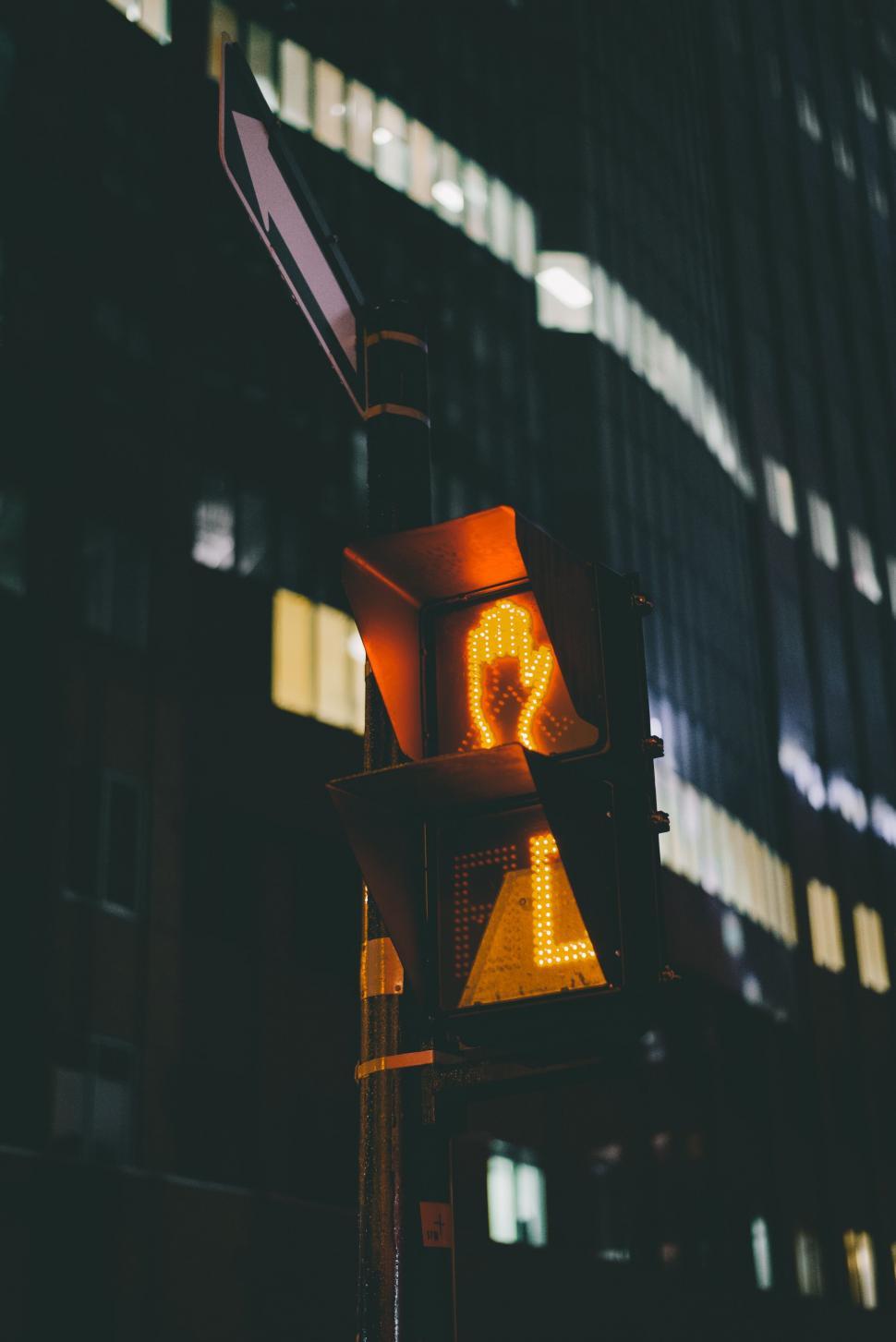 Free Image of A traffic light with a person walking sign 
