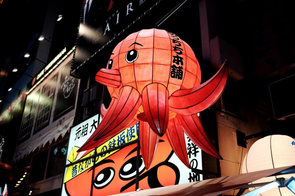 Free Image of A red octopus lantern in a city 