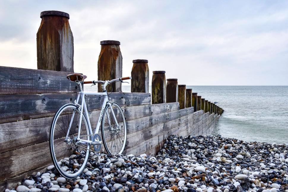 Free Image of A bicycle on a rocky beach 