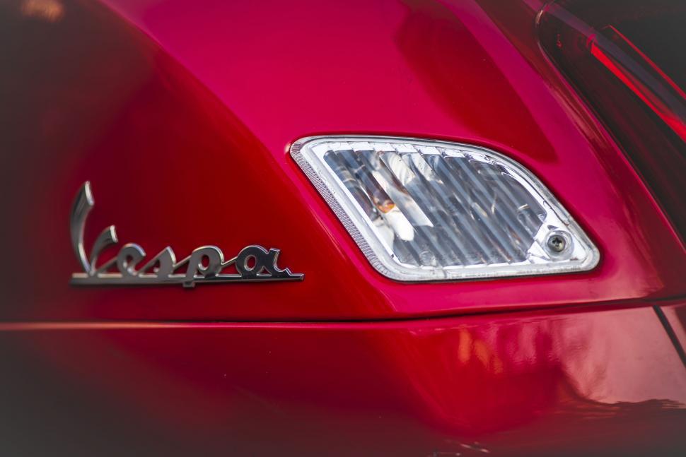 Free Image of The front of a red car 