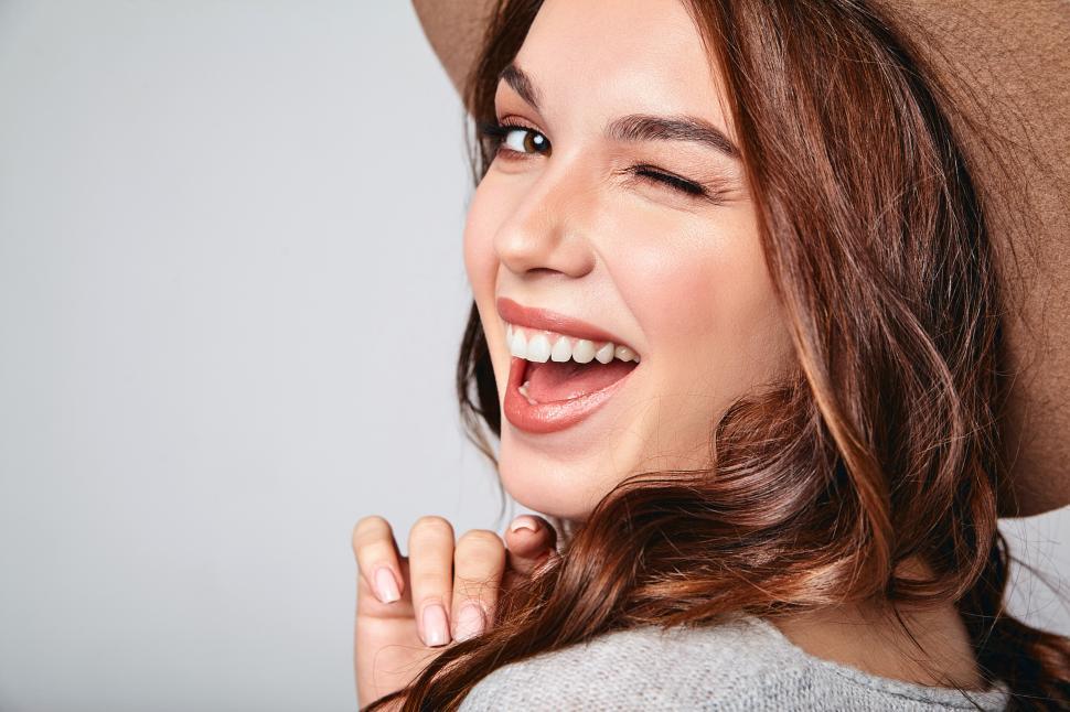 Free Image of A woman winking and laughing 