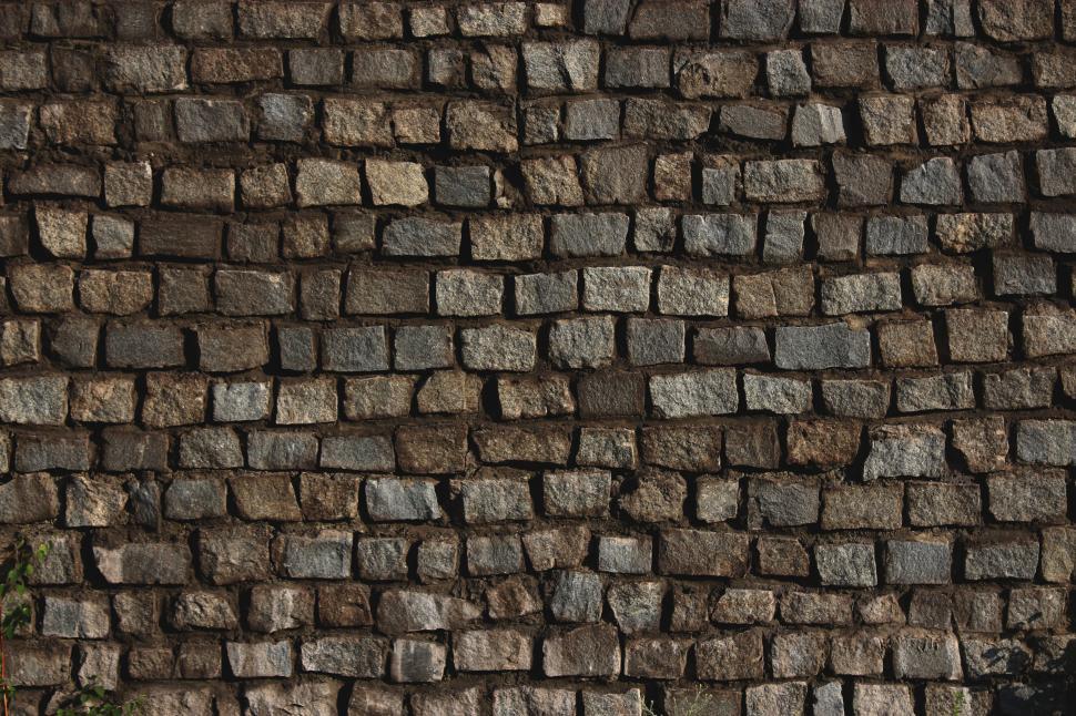 Free Image of A wall of stones with small squares 