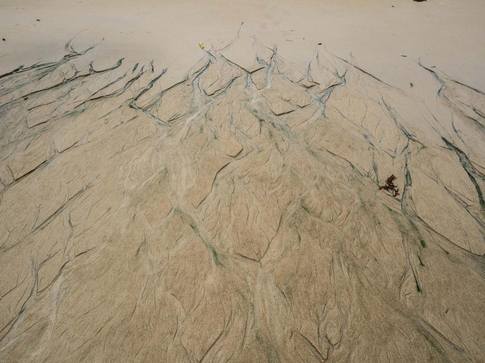 Free Image of A sand with water flowing through it 