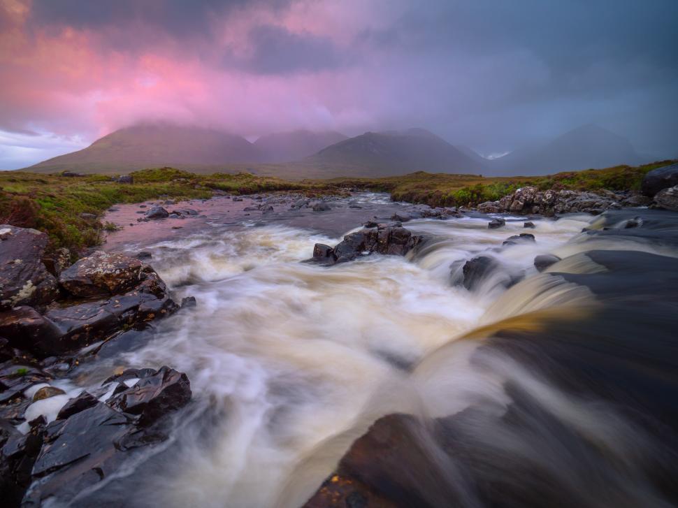 Free Image of A river flowing through a rocky landscape 
