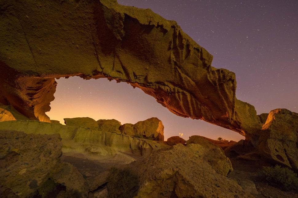 Free Image of A rock formation with a starry sky 