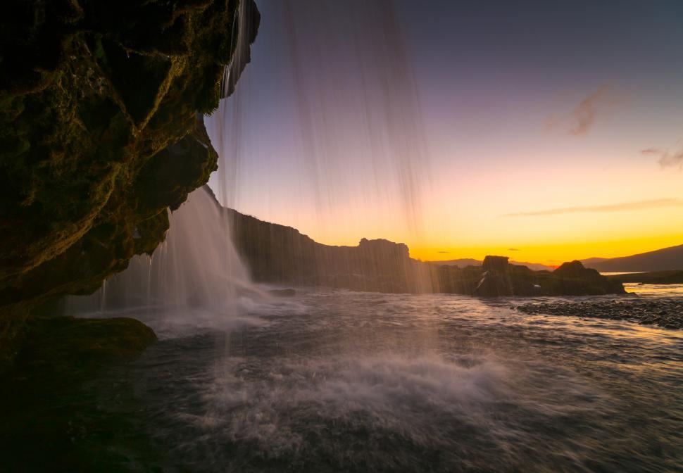 Free Image of A waterfall over a rocky cliff 