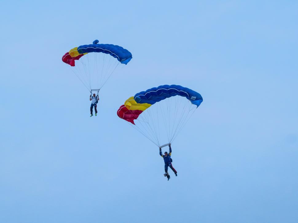 Free Image of Two people with parachutes in the air 