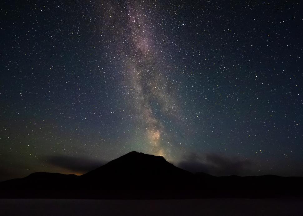 Free Image of A mountain with stars in the sky 