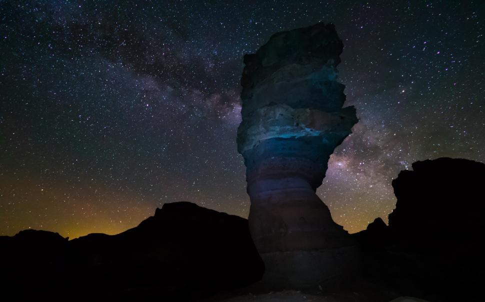 Free Image of A rock formation with stars in the sky 