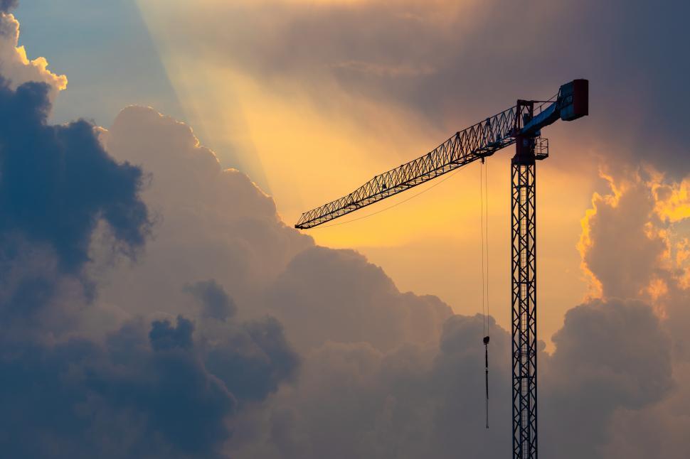 Free Image of A crane in front of clouds 