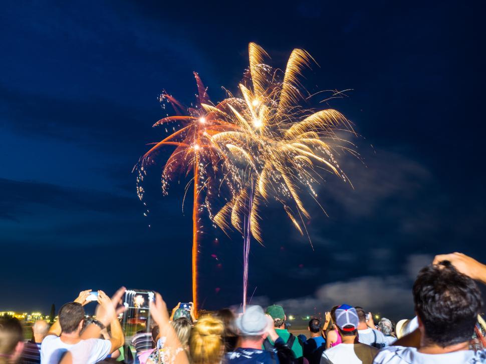 Free Image of A group of people watching fireworks 