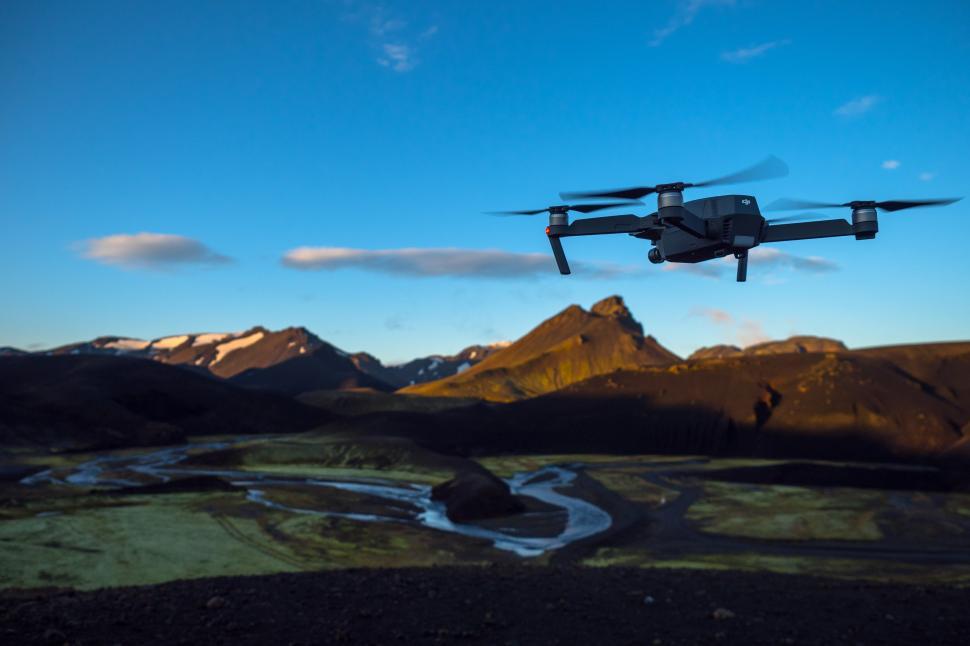 Free Image of A drone flying over a valley 