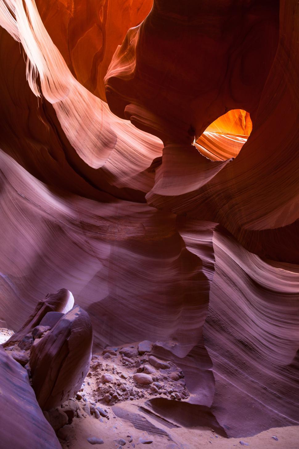Free Image of A red rock canyon with a hole in it 