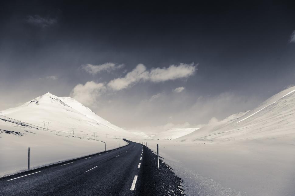 Free Image of A road through a snowy landscape 