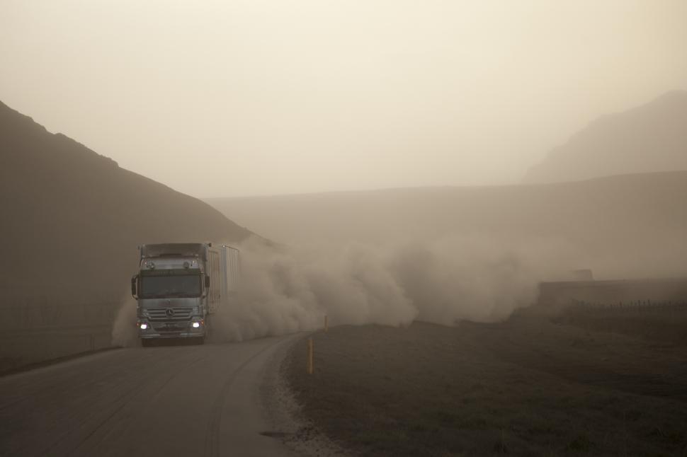 Free Image of A truck driving on a road 