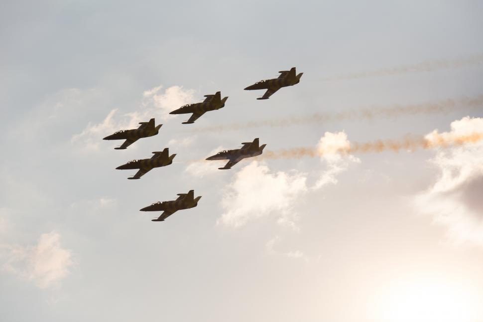 Free Image of A group of airplanes flying in formation 