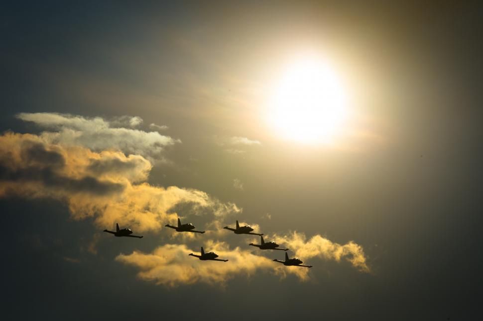 Free Image of A group of jets flying in the sky 