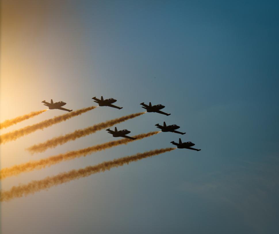 Free Image of A group of airplanes flying in formation 