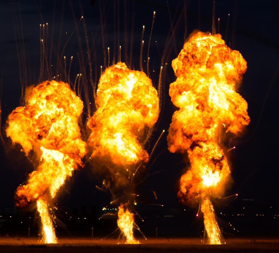 Free Image of A group of fireball explosions 
