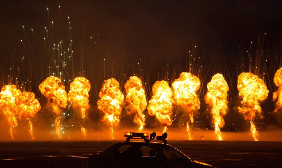Free Image of A group of explosions in a field 