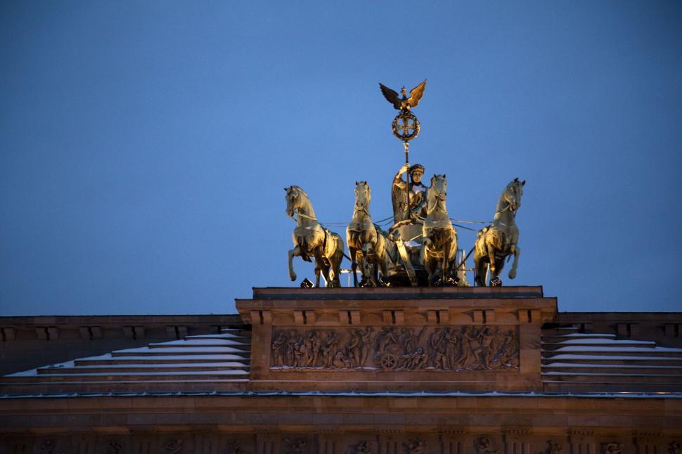Free Image of A statue of a man on a horse with a star on top of it 
