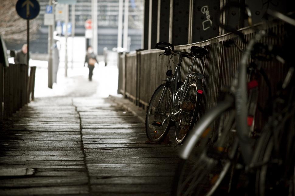Free Image of Bicycles parked on a sidewalk 