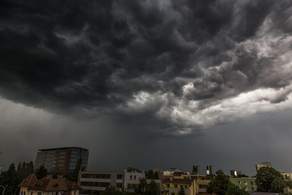 Free Image of A dark clouds over a city 
