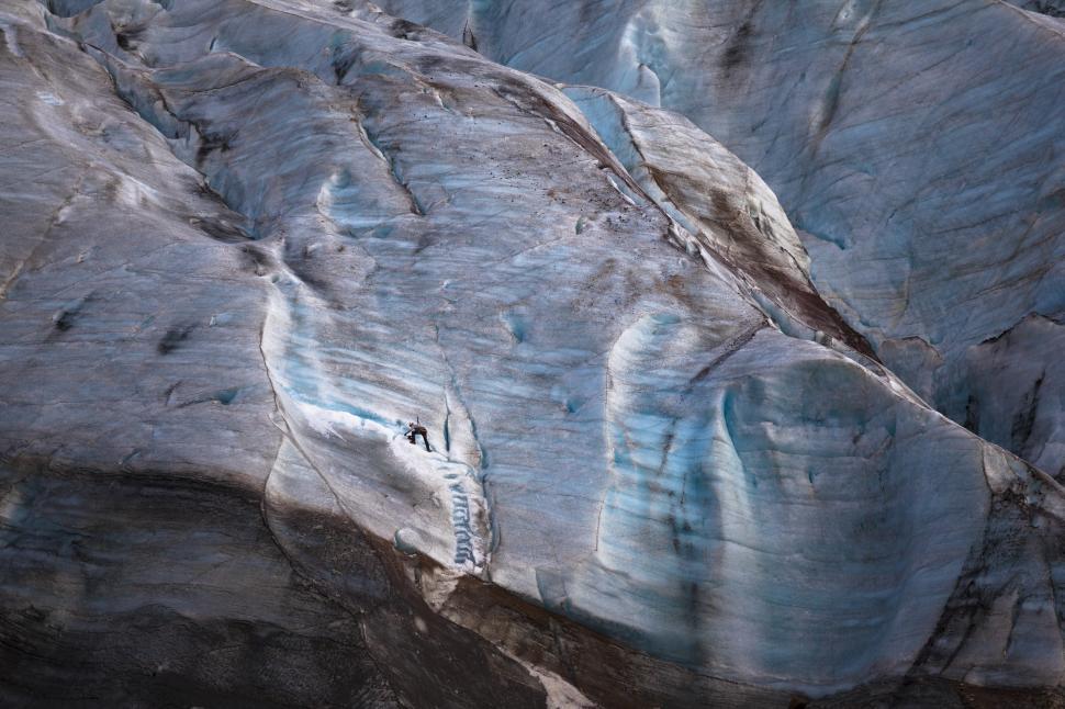 Free Image of A person climbing a glacier 