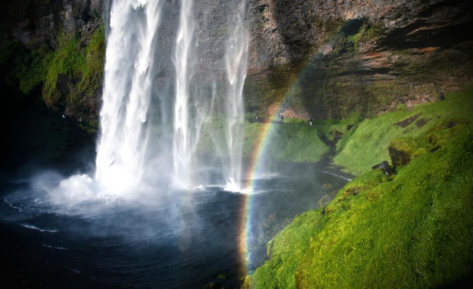 Free Image of A rainbow over a waterfall 