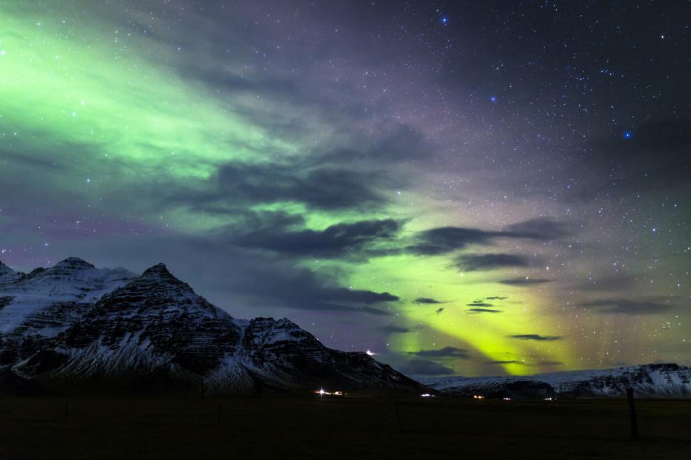 Free Image of A green Auroras in the sky over mountains 