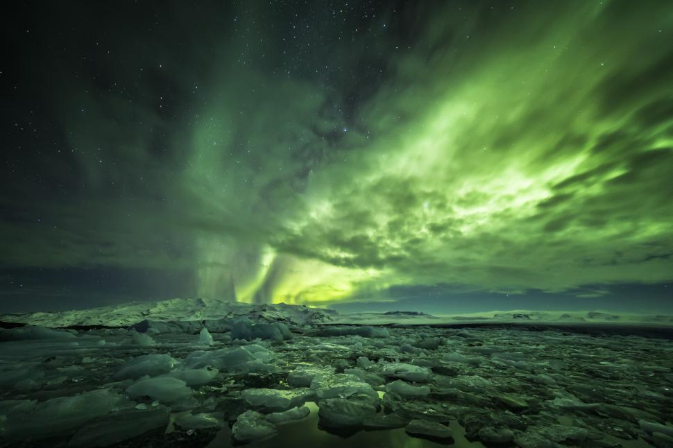 Free Image of Bright auroras in the sky above icebergs 