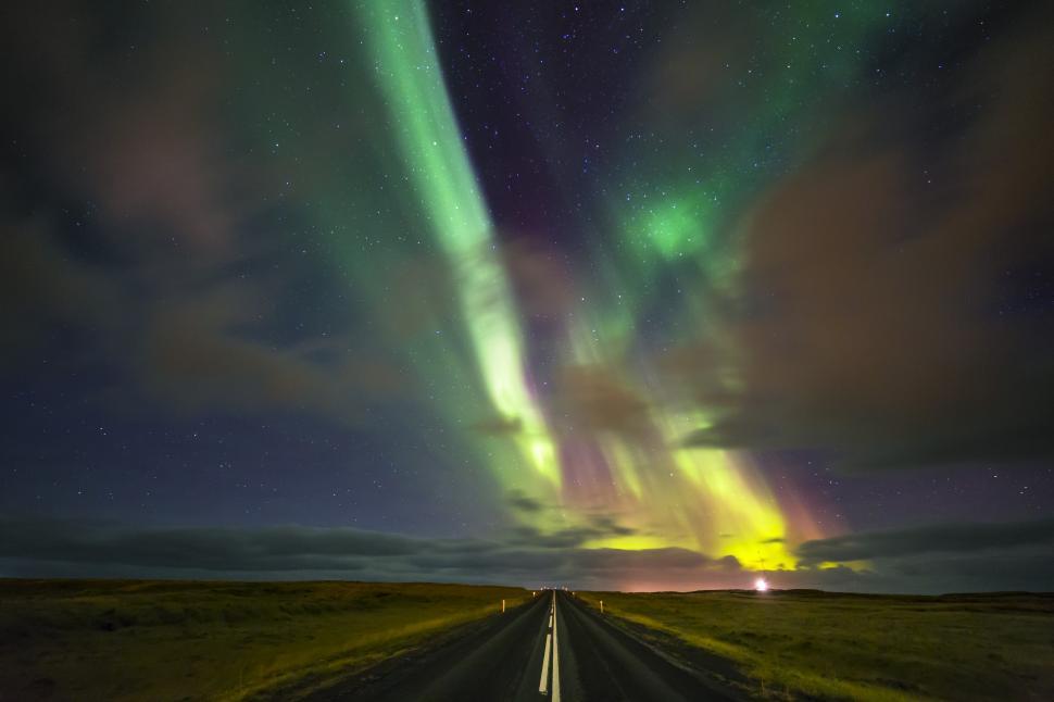 Free Image of A road with green lights in the sky 