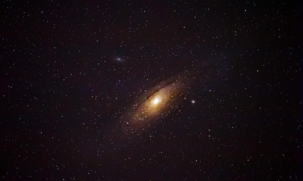 Free Image of A galaxy in the sky with gallery arcturus in the background 