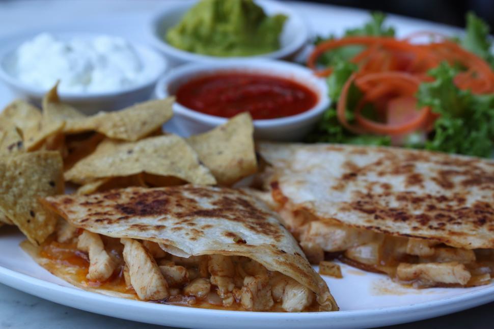 Free Image of White Plate With Quesadilla and Chips 