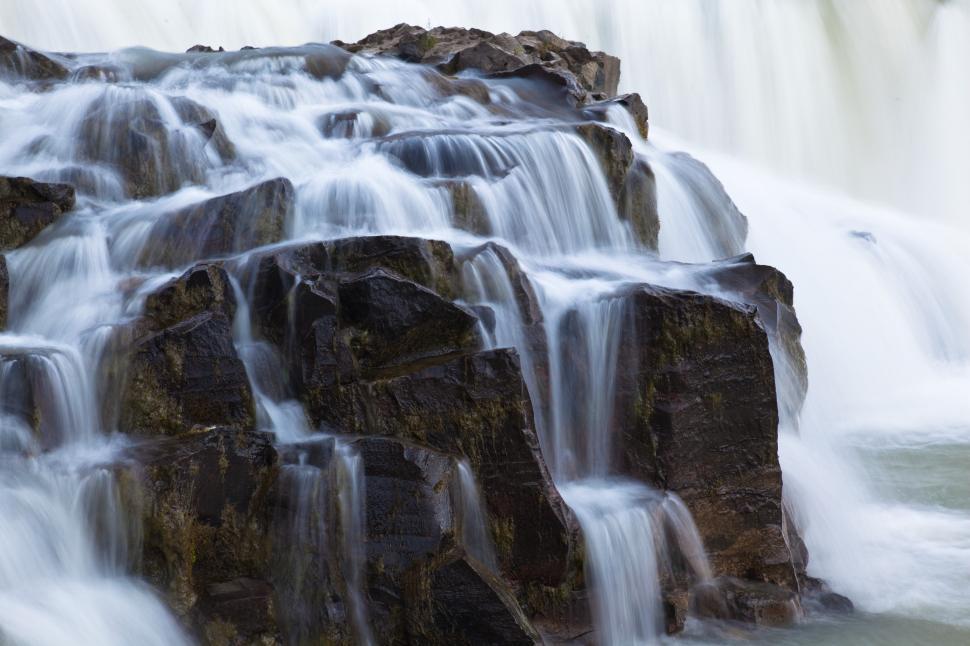 Free Image of A waterfall with rocks and water 