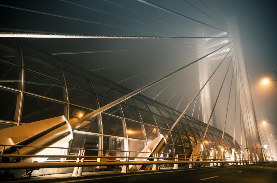 Free Image of A bridge with glass and steel cables 