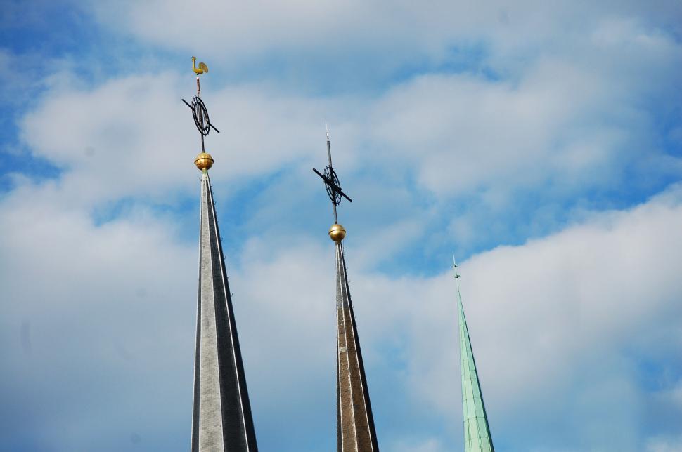 Free Image of A spires with weather vanes on top 