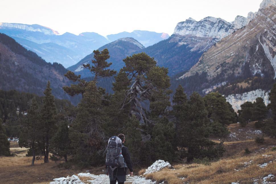 Free Image of A person with a backpack hiking in the mountains 