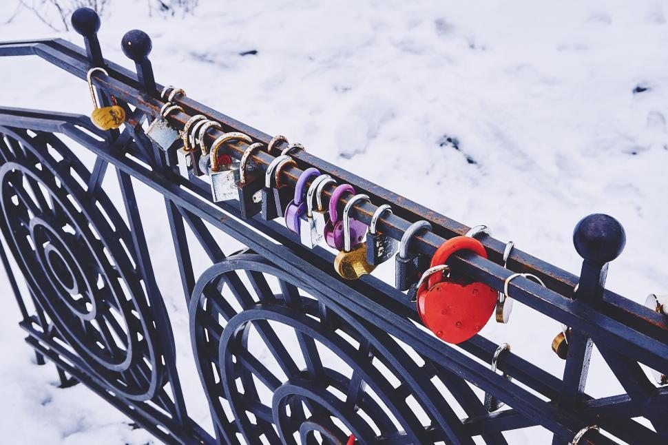 Free Image of A group of locks on a fence 