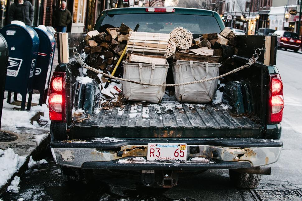 Free Image of A truck with wood in the back 
