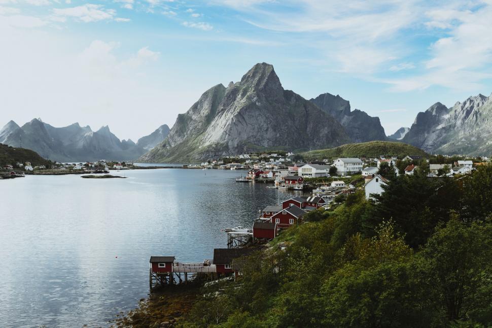 Free Image of A town on the water with lofoten in the background 