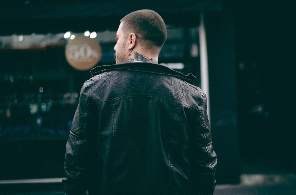Free Image of A man with a tattoo on his neck 