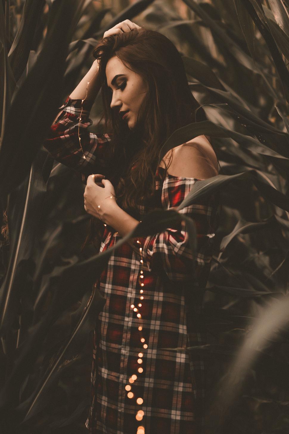 Free Image of A woman in a plaid shirt 