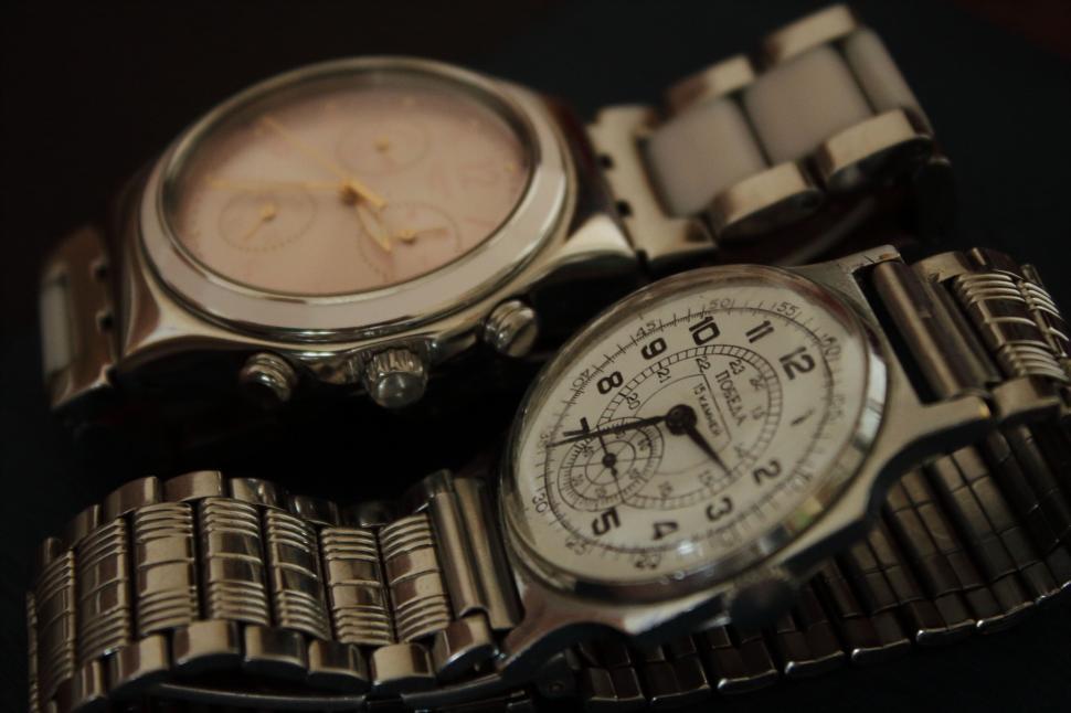 Free Image of A couple of silver wrist watches 